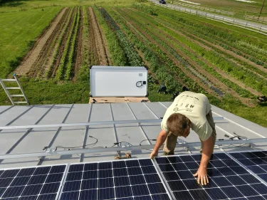 Solar panels being installed on a farm field