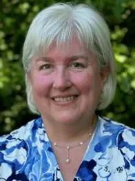 Smiling woman with white hair