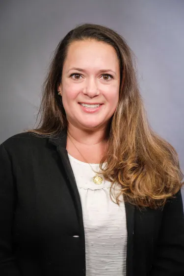 A person wearing a dark jacket