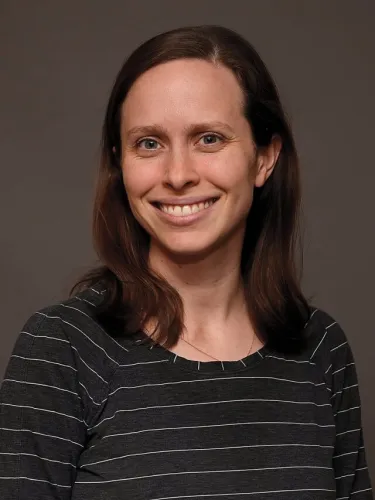 A person wearing a striped shirt