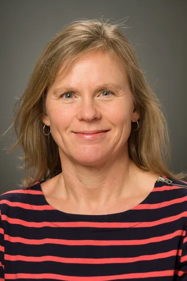 A person wearing a striped shirt