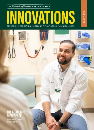 UVMCC Innovations Cover: A man with a beard and white lab coat sits facing the viewer