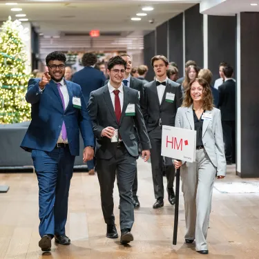 students traversing a hallway at the SG-FECC competition