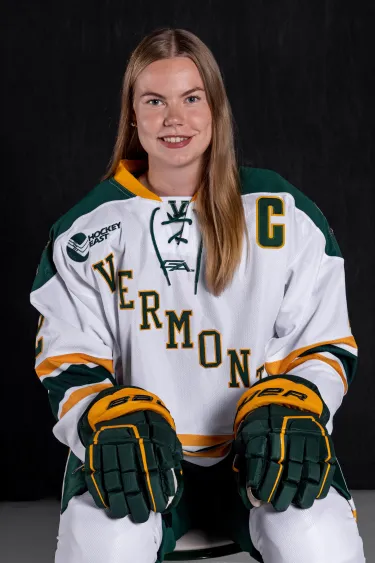 Young Woman in UVM Hockey uniform