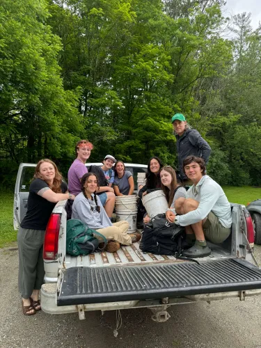 group of people in bed of truck