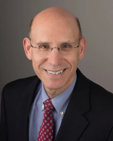 a person in a blazer and tie