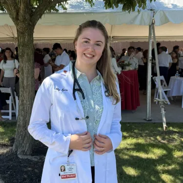 Lily Kjendal in a white coat