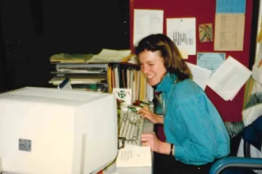 Katie Shepherd in a photo from the 1980s, laughing in front of a computer