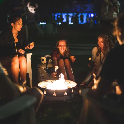 students around a bonfire