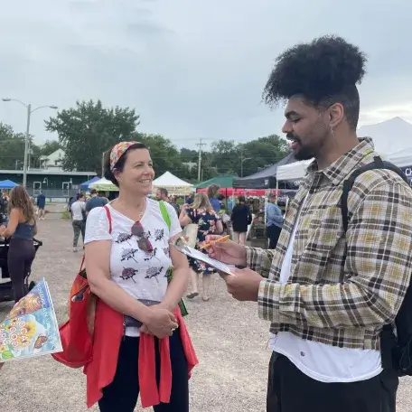 Students doing a survey at a farmer's market