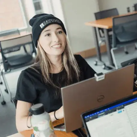 Lily works on her laptop