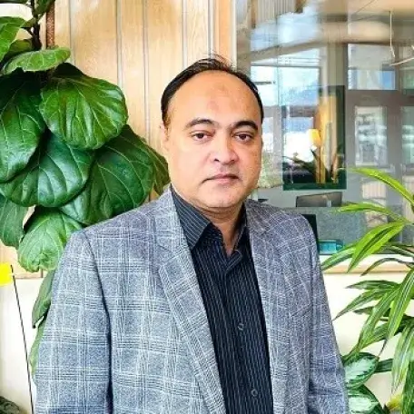 Professor Udin standing in the Aiken Solarium.