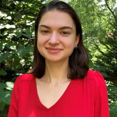 Samantha in a red blouse.
