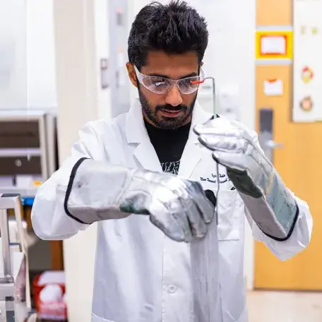 Graduate student working in a Mechanical Engineering lab