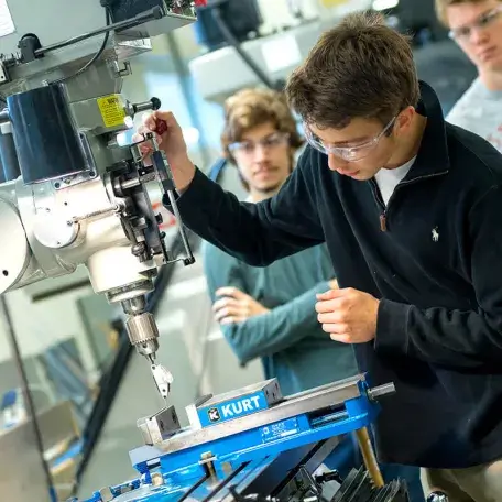 Students learning how to use the equipment in the CEMS machine shop