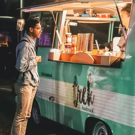 food truck at night with a customer waiting