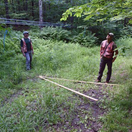 Link, two men in a sugarbush with some sugaring equipment