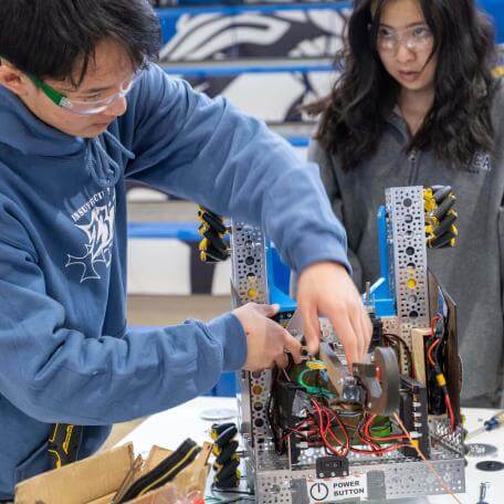 Students preparing their robot for competition