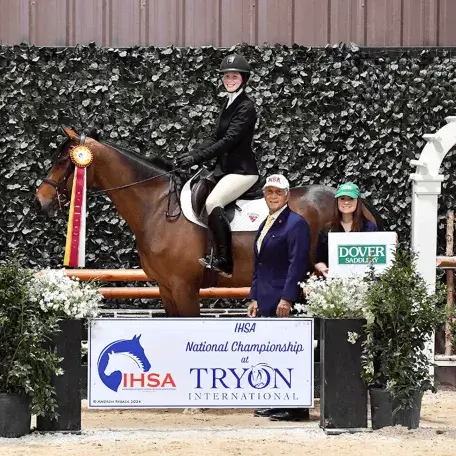 Girl on a horse winning the National Equestrian Championships