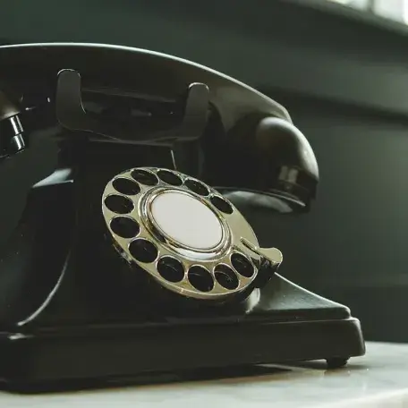 old rotary phone on a table