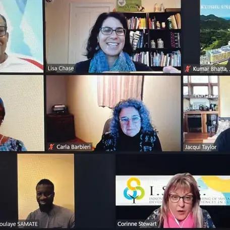 screenshot of an online webinar with several video squares of people's faces