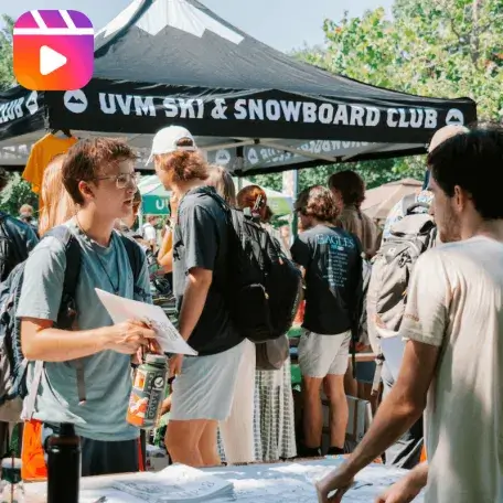Students interact at an outdoor tabling event