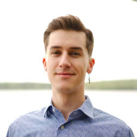 Current CMB student, Cameron, short haired male in blue button down shirt. 