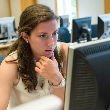 Student working on a desktop computer