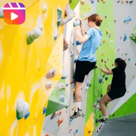 People climb on a bouldering wall