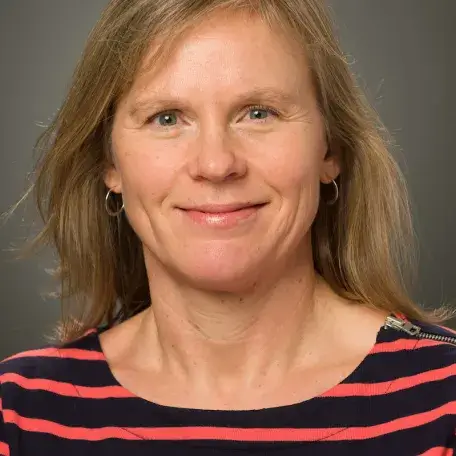 A person wearing a striped shirt