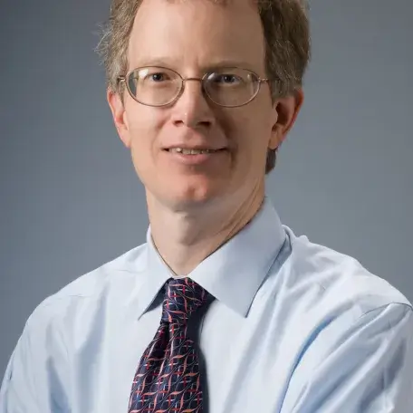 A person wearing a shirt and tie 