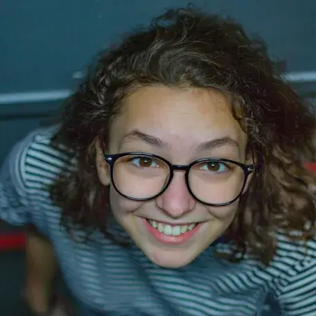 smiling student wearing glasses