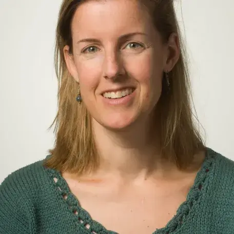 A person wearing a green shirt 