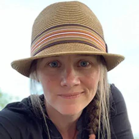 woman wearing tan hat