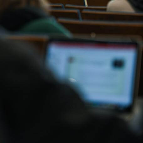 view over the shoulder of person attending a webinar