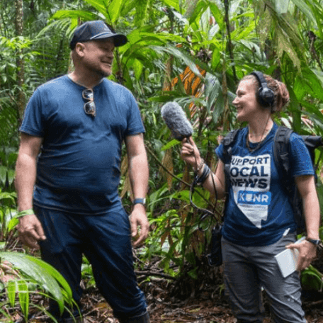 University of Nevada, Reno student Kat Fulwider, reporting from Costa Rica for KUNR. They are standing in a lush jungle.