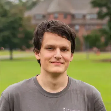 Max Stieglitz, headshot, in front of Redstone Hall