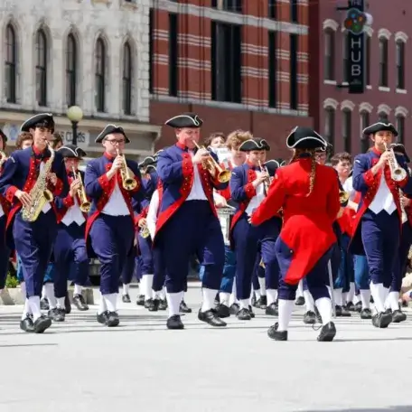 The vrass section of a big marching band performs at the 2023 Loyalty Parade.