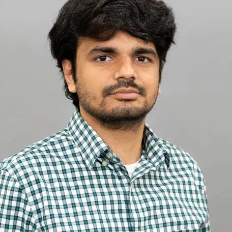 a person wearing a plaid shirt