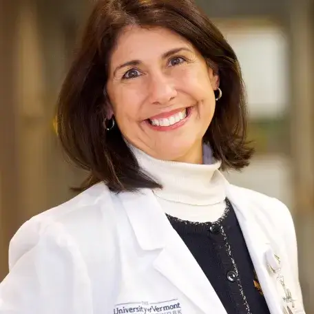 A person wearing a white coat 