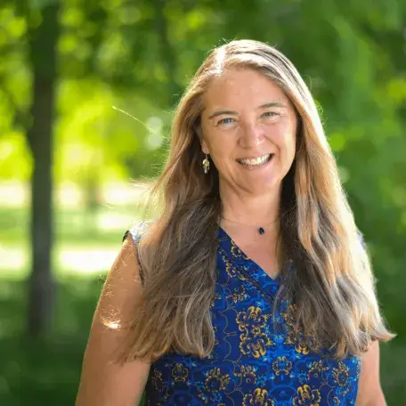 Photo of a woman in a blue shirt