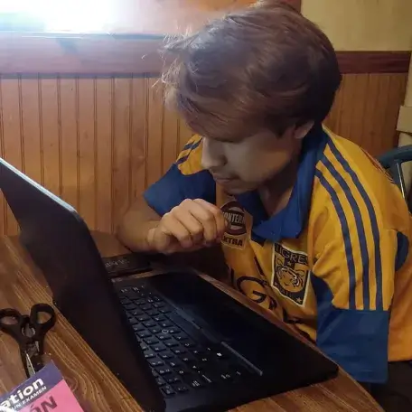 young man studying at a computer