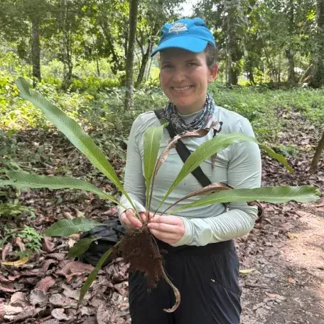 Sarah holding a very large spreading fern