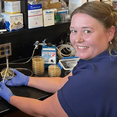 Theresa Montgomery working in a lab at UVM