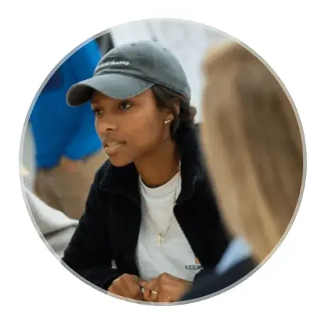Woman in cap in conversation