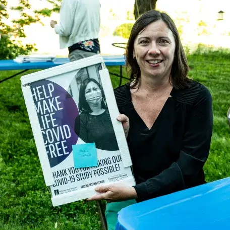 VTC worker with recruitment poster