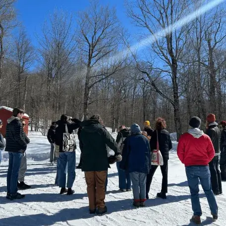 Students visiting maple sugar bush