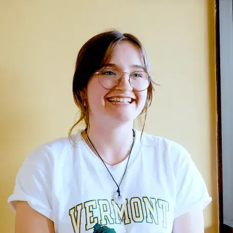 A young woman smiling and wearing a VT t-shirt