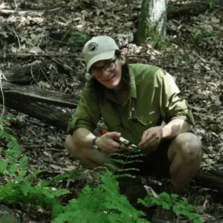 A young man testing in the woods