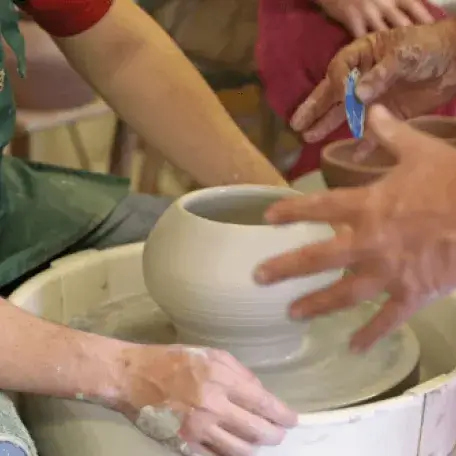 people making pottery